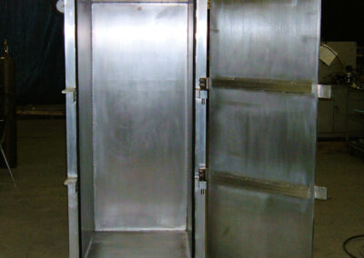 This is an image of a hinged-door vacuum chamber, approximately 7 foot tall