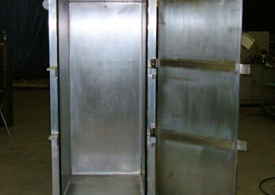 This is an image of a hinged-door vacuum chamber, approximately 7 foot tall